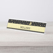 Gouden glanzende kerststerren, poten op goud & zwa bureau naambordje (Voorkant)