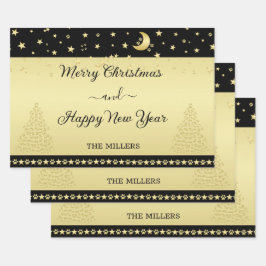 Gouden glanzende kerststerren, poten op goud & zwa inpakpapier vel