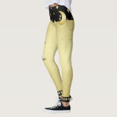 Gouden glanzende kerststerren, poten op goud & zwa leggings (Links)