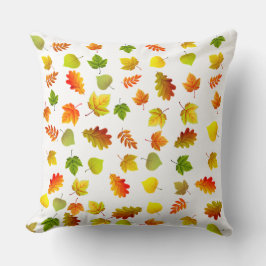Gouden, groene, oranje herfstbladeren op wit kussen