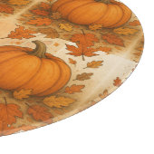 Gouden herfstpompoen en vallende bladeren snijplank (Hoek)