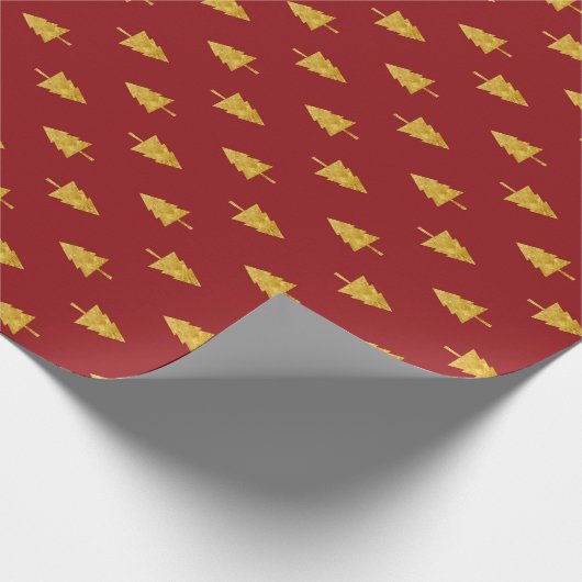 Gouden kerstbomen op rode achtergrond cadeaupapier (Hoek)