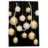 Gouden kerstboomornamenten op zwart medium cadeauzakje (Voorkant)