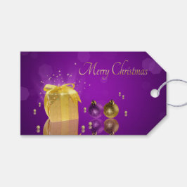 Gouden kerstcadeau doos op paarse lavendel cadeaulabel