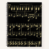 Gouden muziek op zwart notitieboek (Voorkant)