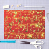 gouden muzieknoten in het rood tissuepapier (Craft)