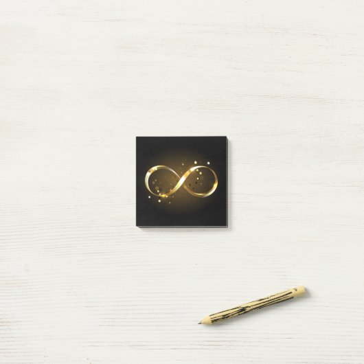 Gouden oneindigheidssymbool post-it® notes (Op bureau)