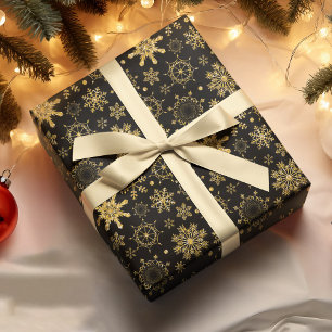 Gouden sneeuwvlok op zwarte achtergrond Kerstmis Cadeaupapier