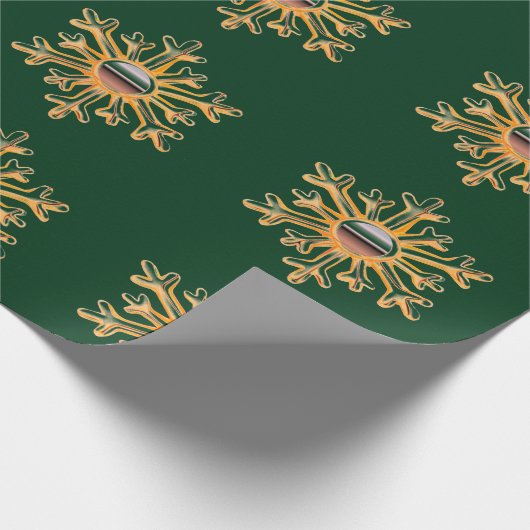 Gouden sneeuwvlokken op groen inpakpapier (Hoek)