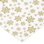 Gouden sneeuwvlokken op wit tafelkleed (Gekanteld)