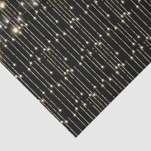 Gouden sprankelende lichten op zwart tissuepapier (Detail)