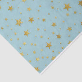 Gouden sterren en kralen over lichtblauwe achtergr tissuepapier (Detail)