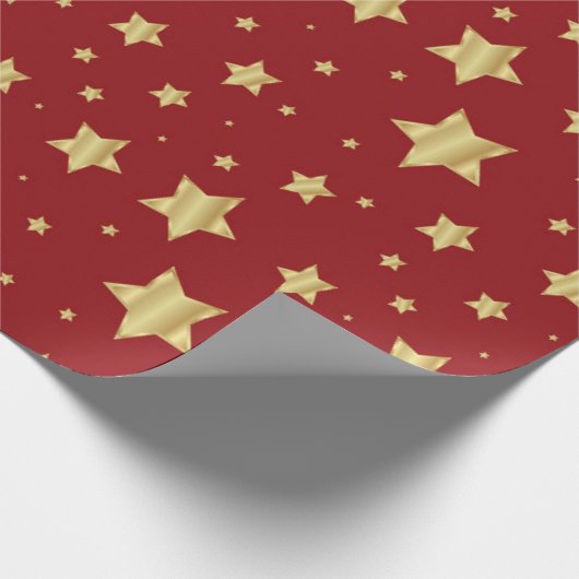 Gouden sterren op rode achtergrond cadeaupapier (Hoek)