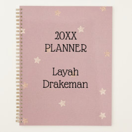 Gouden sterren op roze jaarlijks planner