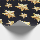 Gouden sterrenpatroon cadeaupapier (Hoek)