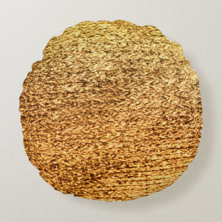 Gouden textiel: glamoureuze macro achtergrond. rond kussen
