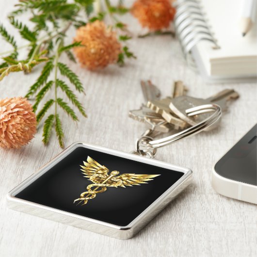 Gouden veelhoekig symbool Caduceus Sleutelhanger (Zijkant)