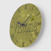 Gouden Victoria naam gemaakt met gouden orchideeën Grote Klok (Hoek)