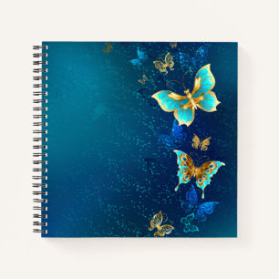 Gouden vlinders op een blauwe achtergrond notitieboek