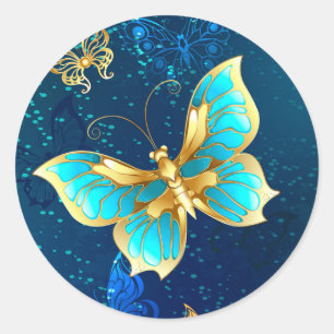 Gouden vlinders op een blauwe achtergrond ronde sticker