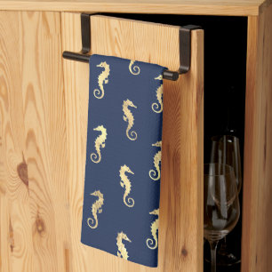 Gouden zeepaarden op marineblauw theedoek