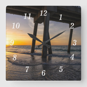 Gouden zonsopgang onder Pensacola Pier Wall Clock Vierkante Klok