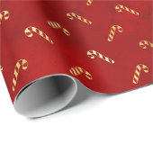 Goudkerstsnoerrietjes op rood cadeaupapier (Rol Hoek)