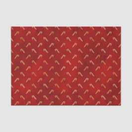 Goudkerstsnoerrietjes op rood tissuepapier