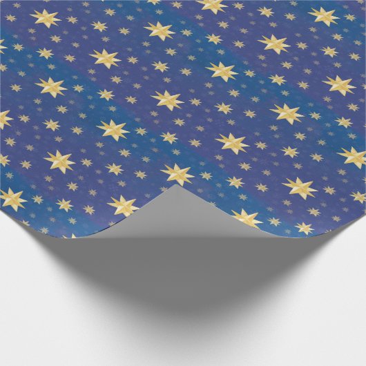 Goudkerststerren op blauw cadeaupapier (Hoek)