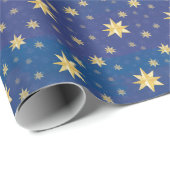 Goudkerststerren op blauw cadeaupapier (Rol Hoek)