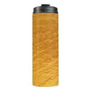 Goudkleurige betonwandtextuur abstract, oud, thermosbeker