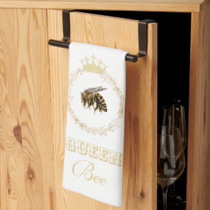Goudkleurige keukendoek met afbeelding van een kon theedoek