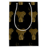 Goudolifant met zwarte cadeautas op achtergrond (Voorkant)