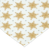 Goudsneeuwvlokken op de witte winter tafelkleed (Gekanteld)