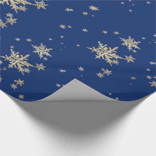 goudsneeuwvlokken op marineblauw cadeaupapier (Hoek)