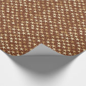 Goudsterren op chocoladebruin cadeaupapier (Hoek)
