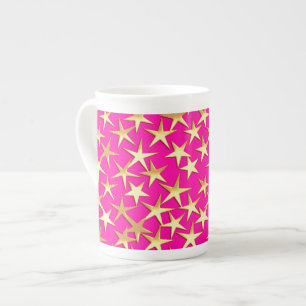Goudsterren op de roze fuchsia roze porselein kop