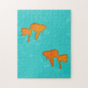 Goudvis oranje silhouettes in turkooiswater legpuzzel