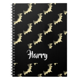 Goudvlekken op zwart notitieboek