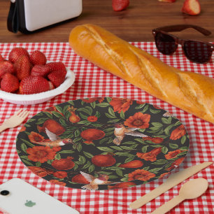 Granaatappels en kolibries / groene bladeren op zw papieren bordje