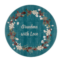 Grandma Christmas wreath on a rich teal  Snijplank