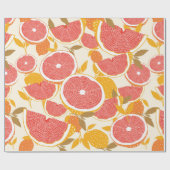 Grapefruit en halve snijwonden met bladeren op wit cadeaupapier (Vlak)