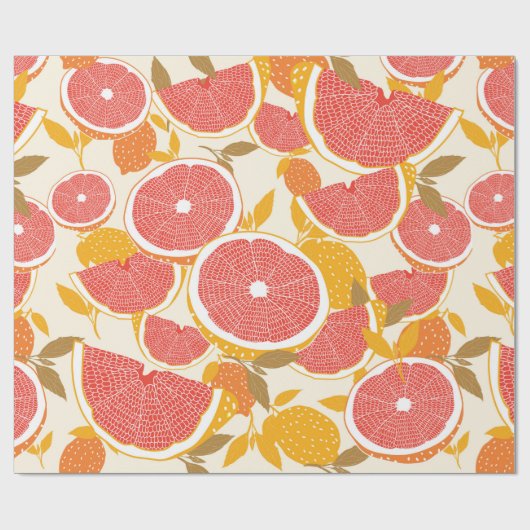 Grapefruit en halve snijwonden met bladeren op wit cadeaupapier (Vlak)