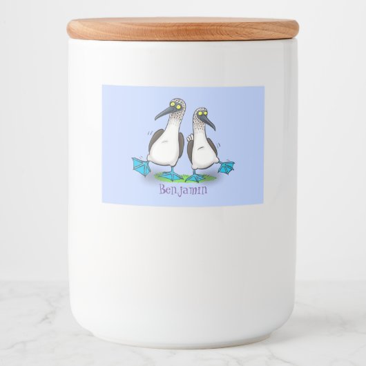 Grappig, gelukkig blauw gefundeerde cartoon die op voedselcontainer etiket (Voorkant)