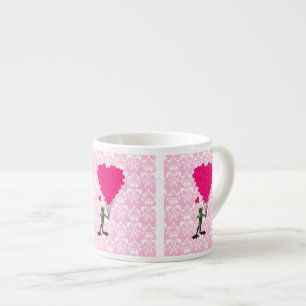 Grappig kikker cartoon en roze hart op vouw espresso kop