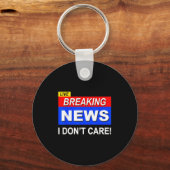 Grappig nieuws: sarcasme kan me niets schelen sleutelhanger (Voorkant)