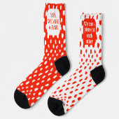 Grappig paar van tegenovergestelde gekleurde rood  sokken (Links)