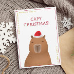 Grappig Schattige Capybara Santa Pun Christmas Feestdagenkaart<br><div class="desc">Verspreid de vreugde van het seizoen met onze 'Capy Christmas' Capybara Santa vakantiekaart. Pas het aan met jouw naam,  waardoor het een oprechte en doordachte begroeting is die overal glimlacht. De capibara illustratie is handgetekend origineel kunstwerk van artbybiyan,  perfect voor capybara liefhebbers.</div>