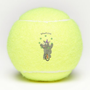Grappig schattige neushoorns over eenwieler tennisballen