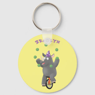 Grappig schattige rhinojongs die jongleren over ee sleutelhanger